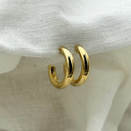 Oorbellen basic goudkleurige halve hoops 2.5 cm