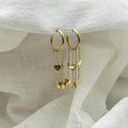 Oorbellen floating hearts goudkleurig