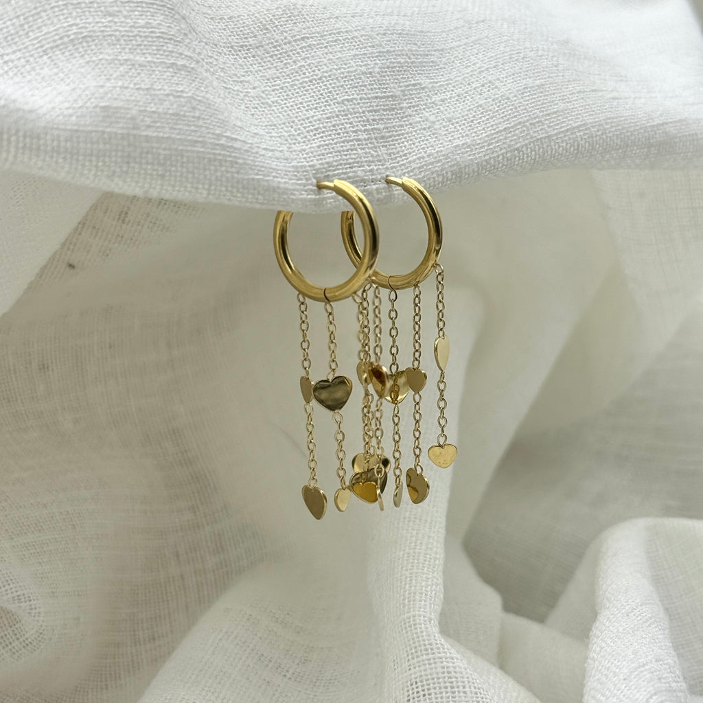 Oorbellen floating hearts goudkleurig
