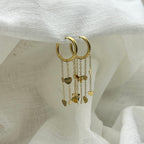 Oorbellen floating hearts goudkleurig